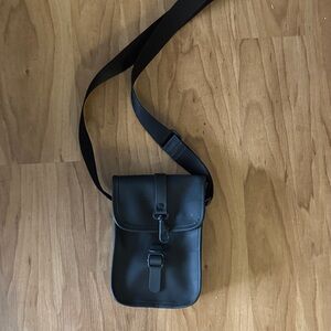 Rain Flight Black Crossbody Bag